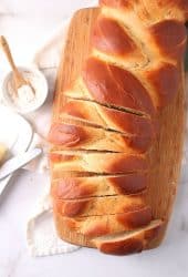 Loaf of vegan challah on cutting board