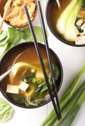 Miso soup in a black bowl