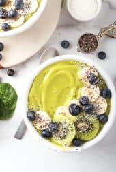 Close up of green smoothie bowl with bananas and blueberries