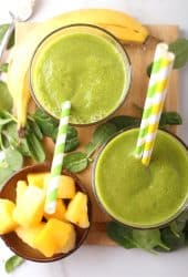 Two Tropical Green Smoothie on a platter