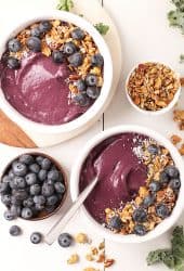 Two vegan blueberry smoothie bowls