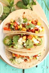 Three vegan tacos on a white plate