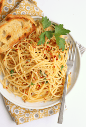 Finished dish on a white plate with toasted bread