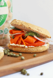 Bagel and Carrot Lox Sandwich on a wooden platter