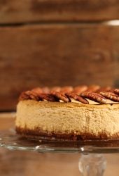 Vegan Pumpkin Cheesecake on a glass cake stand