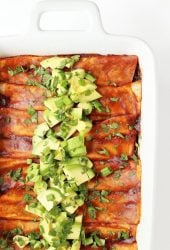 Vegan Enchiladas in a white casserole dish