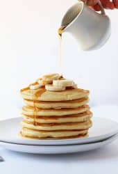 Finished recipe stacked on a white plate with maple syrup