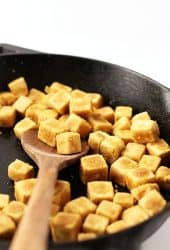 Cubed and sautéd tofu in a skillet