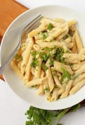 Finished dish in a white bowl with a fork