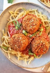 Vegan Meatballs with Tempeh Served over spaghetti and pasta sauce.