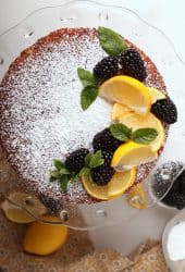 Whole cake with lemons and blackberries