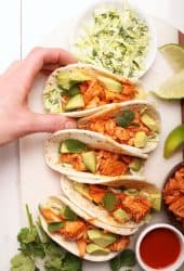 Buffalo Jackfruit tacos on a white board