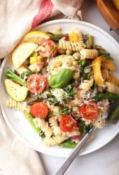 Vegan pasta on a white plate with a fork