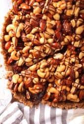 Close up of finished chocolate tart with one slice removed