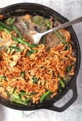 Finished green bean casserole in a cast iron skillet