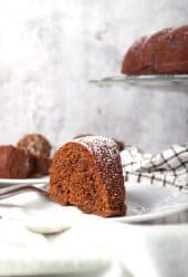 Slice of finished gingerbread cake on a white plate