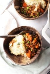 Two servings of shepherd's pie served in two bowls.