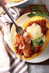 Finished stuffed spaghetti squash with a fork